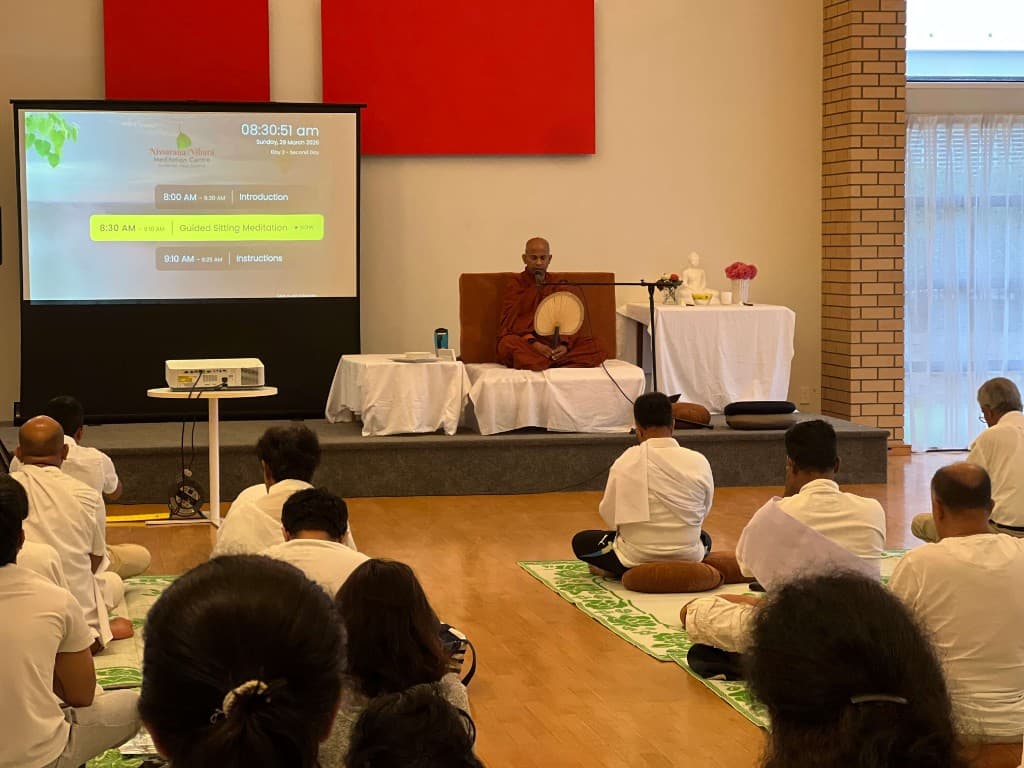 The schedule display projected in the meditation hall during a retreat
